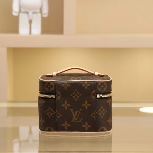 Alternative view of M44936  Nice Nano Cosmetic Case Crafted from Monogram canvas, this compact case can be placed in the bathroom to store nail polish, lipstick, and other beauty essentials, or tucked into a handbag to organize small items. Flatten the handles to store in tight spaces. Size: 14*10.2*8.5 cm